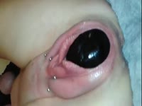 Close up pussy insertion video depicts amateur pushing eggplant out of her stretched snatch